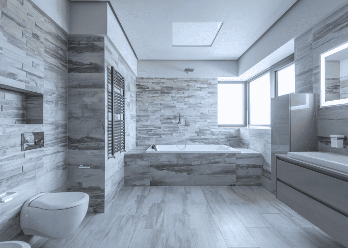 Salle de bain avec vasque sur colonne Rénovation de style contemporain Salle de bain avec douche séparée Salle de bain avec baignoire ronde Salle de bain avec carrelage en verre Rénovation de salle de bain pratique Salle de bain avec matériaux naturels Salle de bain avec décoration moderne Salle de bain lumineuse et aérée Salle de bain avec accessoires design